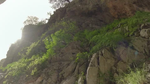 Rocky Cliffs Bathed in Morning Light Stock Footage 282937305