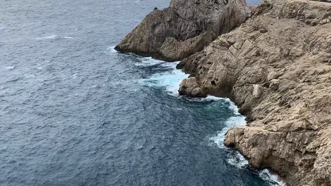 Rocky cliffs in a bay in Mallorca Stock Footage 114955307