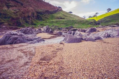 Rocky cliffs on beach Fotos Stock