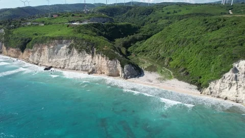 Rocky cliffs framing a small beach cove, aerial view Stock Footage 278369602
