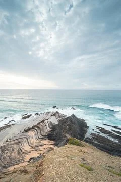 Rocky cliffs with futuristic patterns on the Atlantic coast near the town of  Foto stock