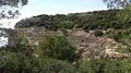 Rocky cliffs landscape with pine trees foreground at Algarve coastline Portugal 4k or 4k+ Resolution