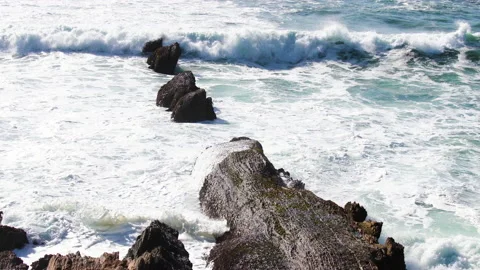 Rocky cliffs by the ocean, view from bluffs, beautiful dramatic seascape backgro Stock Footage 154028418