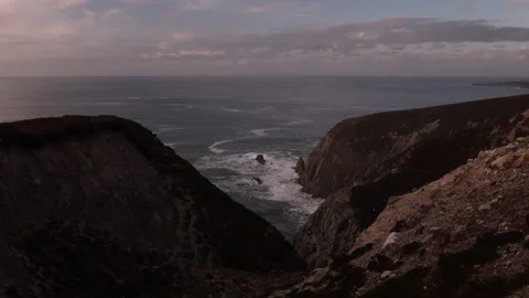 Rocky Cliffs Overlooking Moving Water and Sea Stacks. Achill Island, Ireland. Stock Footage 239486213