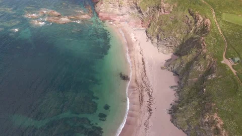 Rocky Cliffs, Sandy Beach &amp; Blue Crystal Clear Ocean - Aerial Drone Footage Stock Footage 160075504