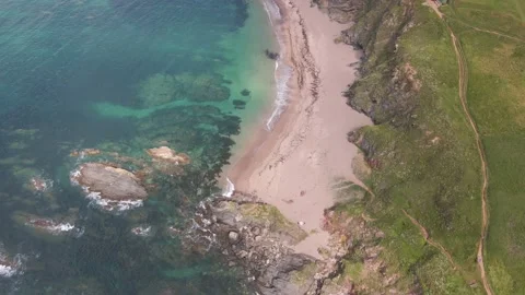 Rocky Cliffs, Sandy Beach &amp; Blue Crystal Clear Ocean - Aerial Drone Footage Stock Footage 160075507