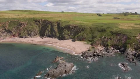 Rocky Cliffs, Sandy Beach &amp; Blue Crystal Clear Ocean - Aerial Drone Footage Stock Footage 160075611