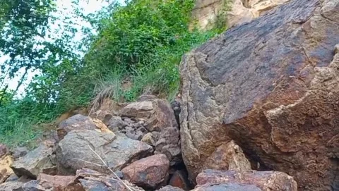 Rocky cliffs surrounded by green trees. Stock Footage 326866710