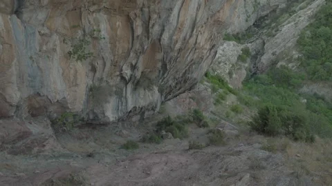 Rocky Cliffside with Vegetation Stock Footage 282240580