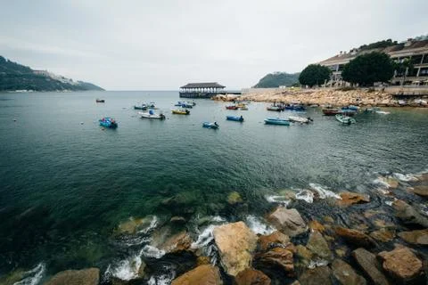 Rocky coast and boats at Stanley, on Hong Kong Island, Hong Kong. Stock Photos