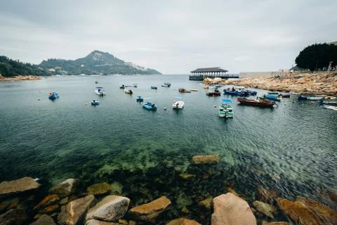 Rocky coast and boats at Stanley, on Hong Kong Island, Hong Kong. Stock Photos
