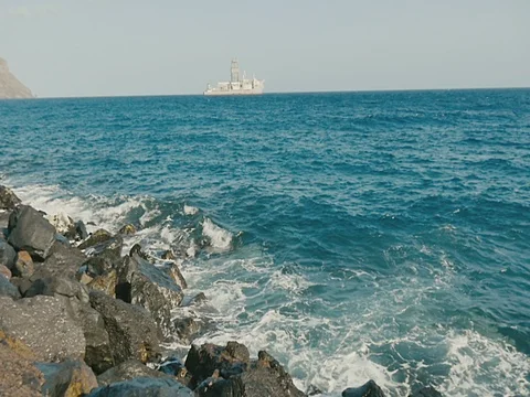 Rocky coast and ship is stranded or grounded on horizon. Stock Footage 71053666
