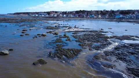 Rocky Coast and Spring Runoff in Saint-Ulric-de-Matane, Quebec Stock Footage 335780166