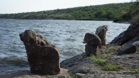 Rocky coast with bumping waves into it Stock Photos
