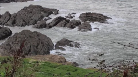 Rocky coast with waves crashing Stock Footage