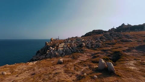 Rocky Coastal Cliff Overlooking Deep Blue Ocean Video stock 340463961