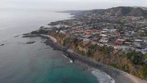 Rocky Coastal Cliffs and Homes, Orange County, Aerial Pass, 4K Stock Footage 147910831