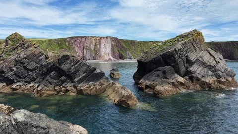 Rocky Coastal Cliffs at Ballydwan Beach Waterford Ireland Stock Footage 337396977