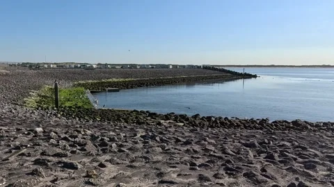 Rocky coastal landscape with an intertidal zone and open marine waters. Stock Footage 340229741