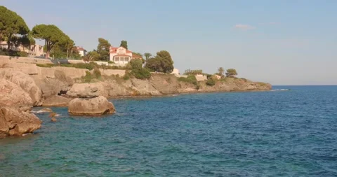 Rocky Coastline and Blue Sea at Cap d'Ail Coastal Path, French Riviera, Summer Stock Footage 342935053