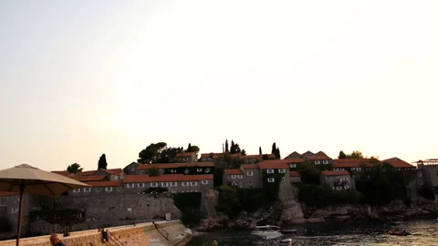 Rocky coastline with cliffs, trees and nice cozy houses with red roofs on the Stock Footage 85646085