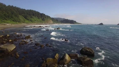 Rocky coastline flyover Stock Footage 70332592