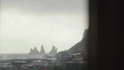 Rocky coastline through window in Vík, Iceland 4K Stock Footage 105019122