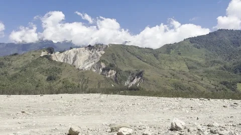 Rocky Dry Riverbed with Quarry Mountain in Baliem Valley Stock Footage 344562084