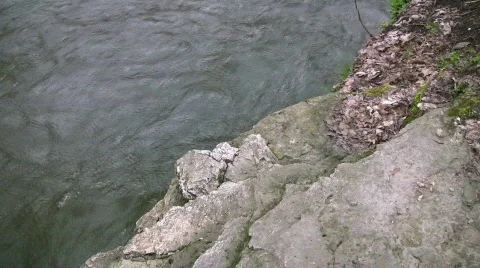 Rocky edge with flowing river below Stock Footage 401008