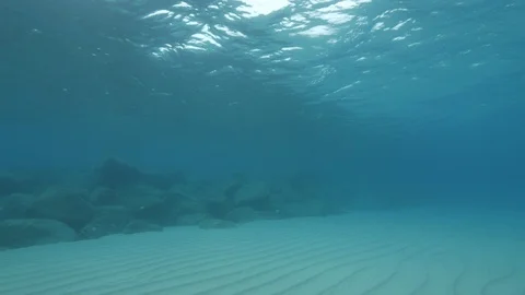 Rocky formation at the sandy seabed, Tropea, Mediterranean sea, Italy Stock Footage 111521173