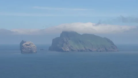 The rocky forms of Boreray, Stac Lee and Stac an Armin in the North Atlantic Stock Footage 229474328