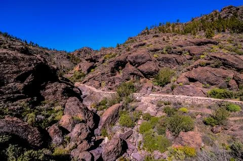A rocky hillside with a path through it Foto stock