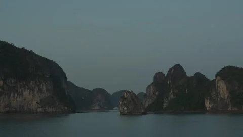 Rocky Islet Between Limestone Cliffs In Ha Long Bay At Sunset Stock Footage 336724182