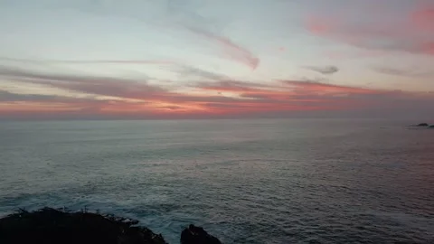 Rocky islets surrounded by calm Pacific Ocean waters off the coast near Faro de Stock Footage 337143251
