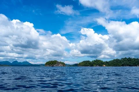 Rocky islets under blue sky, Togian Islands, Sulawesi, Indonesia Stock Photos