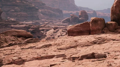 Rocky landscape in a desert area during the daytime with clouds overhead Stock Footage 343529269