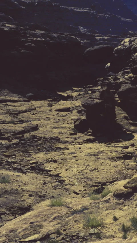 Rocky landscape with dry ground under clear sky at midday Stock Footage 331752002