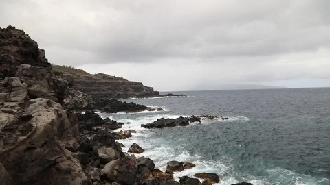 Rocky 'Mars-like' coast by the Ocean Stock Footage 115510712