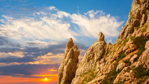 Rocky mount slope at the dramatic sunset Stock Footage 258299500