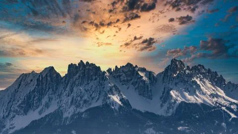 Rocky mountain with a beautiful cloudy dramatic sunset Stock Photos