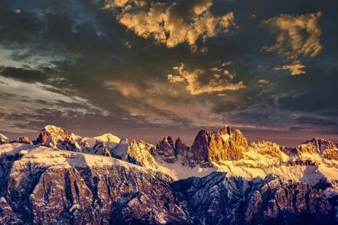 Rocky mountain with a beautiful cloudy dramatic sunset Stock Photos