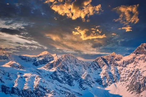 Rocky mountain with a beautiful cloudy dramatic sunset Stock Photos