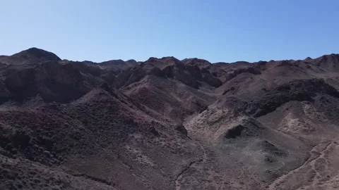 Rocky Mountain Desert – Forward Drone Shot with Tilt-Up Reveal, Kazakhstan Stock Footage 313103382