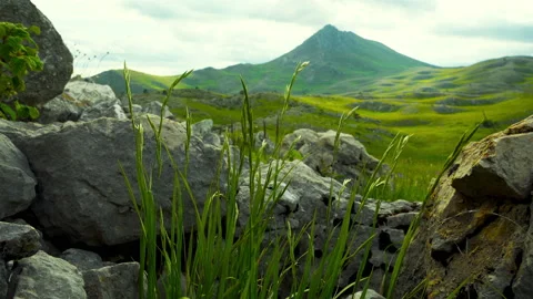 Rocky mountain with a dramatic cloudy sky Stock Footage 133630011