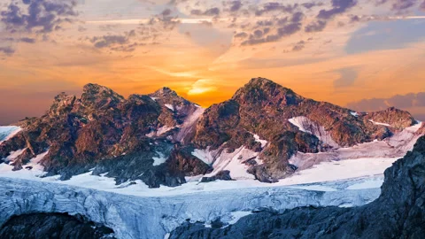 Rocky mountain with glacier at the dramatic sunset Stock-Footage 152385427
