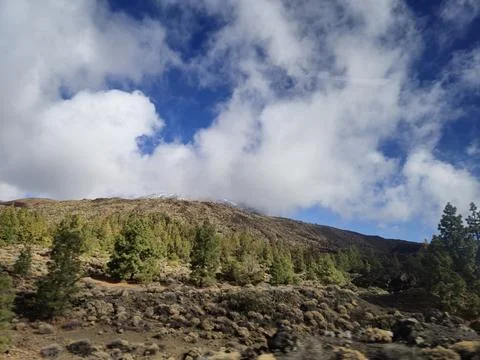 Rocky mountain landscape under dramatic clouded sky Stock Photos