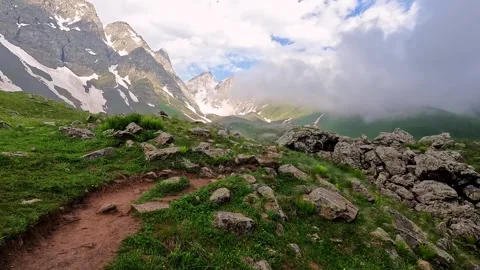 A rocky mountain path leads through the Abudelauri Lakes area Stock Footage 340385217