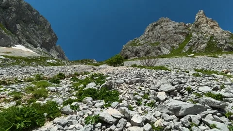 Rocky mountain path under bright blue sky. Savin Kuk peak, Montenegro Stock Footage 342977894
