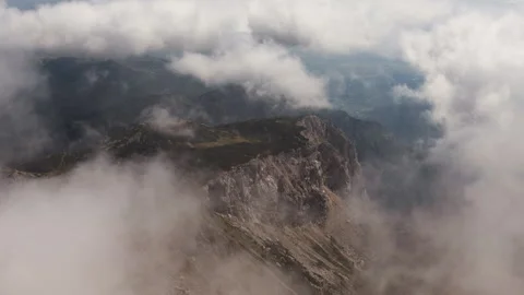 Rocky Mountain Peak Emerging Through Low Clouds in the Alps Vidéo 341317848