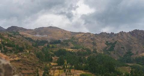 Rocky mountain in the Peruvian puna surrounded by nature on a cloudy day Stock Photos